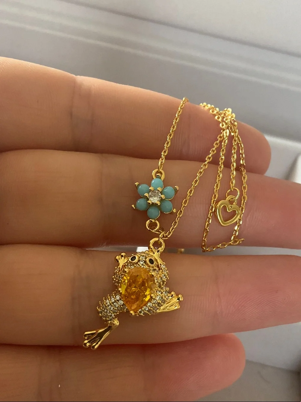 kate spade gold-tone frog pendant necklace with turquoise flower charm